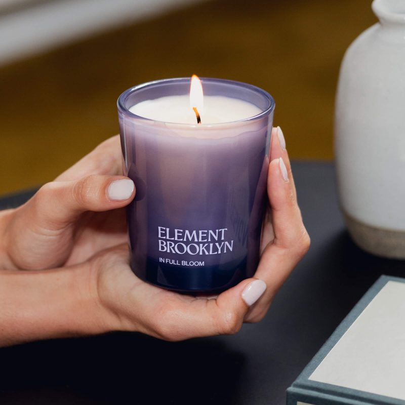 in full bloom candle lifestyle hands lit d390a932 a656 4574 b30d 29a4ede3e6b5